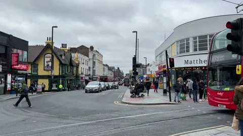 A bus passes through a road junction in West Croydon, UK, 4K Stock Footage 171409122