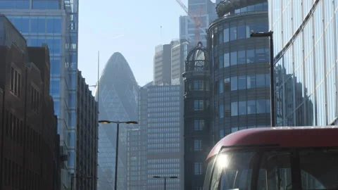 A bus passing on a street with modern high raise buildings. Stock Footage 124506786
