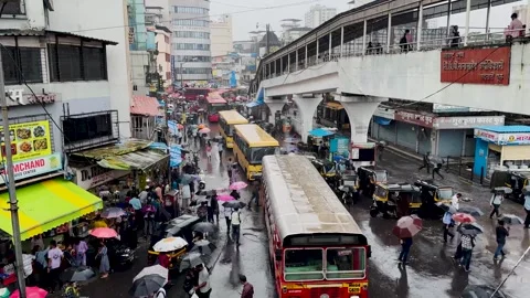Bus passing at Thane station. Rush hour traffic outside Market in Mumbai. 4K Stock Footage 248056779