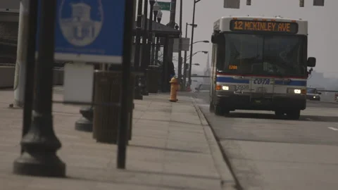 Bus Pulling Away from Bus Stop Stock Footage 148700737