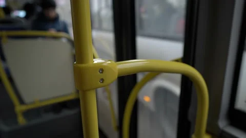The bus pulls up to the stop, the glass doors open and a person enters the cabin 스톡 동영상 124465315