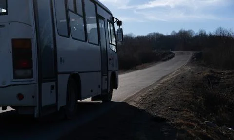 Bus rides on empty road Stock Photos