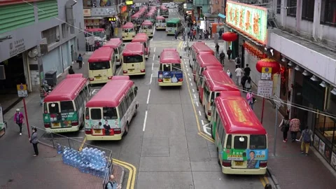 A bus is running on a road in Mong Kok, Hong Kong Stock Footage 233078686