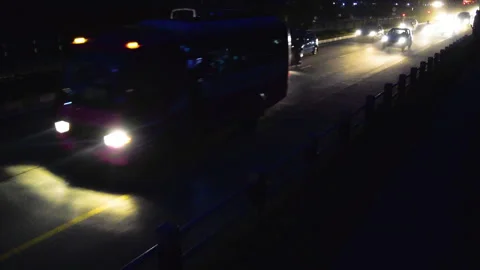 A bus rushing in a Huge traffic full of vehicles in a highway road at night Stock Footage 248733603