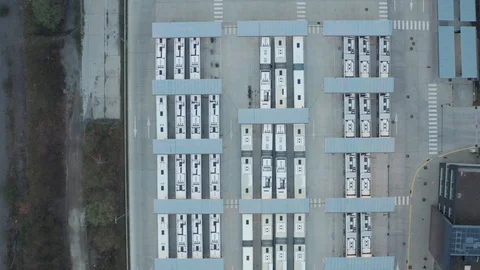 Bus station with many busses in static Aerial drone top down symetric abstract Stock Footage 123112254