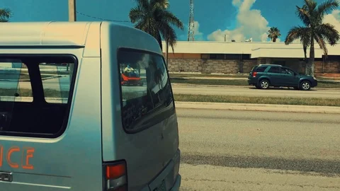 Bus Stop Along Main Road Near Signalized Intersection, Freeport Bahamas Stock Footage 94074360