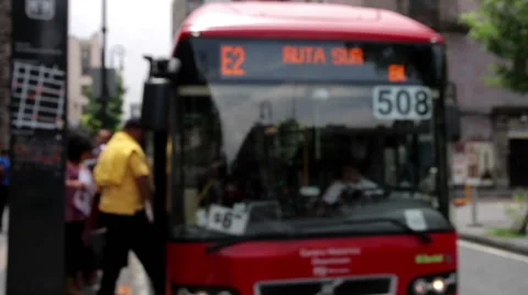 Bus stop blurred image, a bus arrive and open the door. Stock Footage 41060339