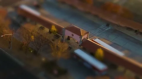 Bus Stop Hyperlapse tilt shift effect at Sunset with miniature car building Video stock 144649076