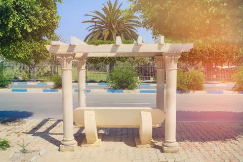 Bus stop made under olden time with stone columns, antique style. Tunisia, So Stock Photos
