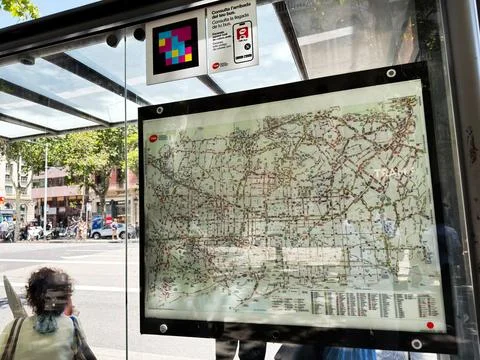 Bus stop map and public transport information panel at a glass shelter on a.. Stock-Fotos