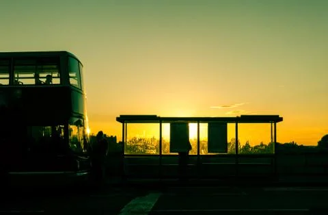 Bus stop at sunset 스톡 사진