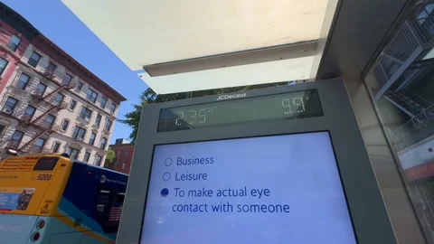 Bus stop thermometer displaying nearly 100°F during heatwave in East Village NYC Stock Footage 342781692