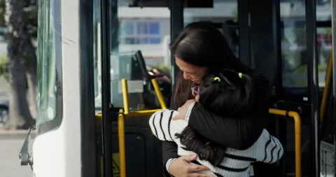 Bus stop, waiting and mom hug child in city after travel, commute and journey Video stock 308439968