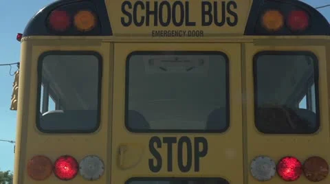 Bus at stoplight drives away slow motion 動画素材 12036688