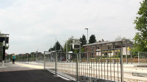 Bus stops to collect passenger at the guided busway Hough Lane, Tyldsley Stock Footage 67889796