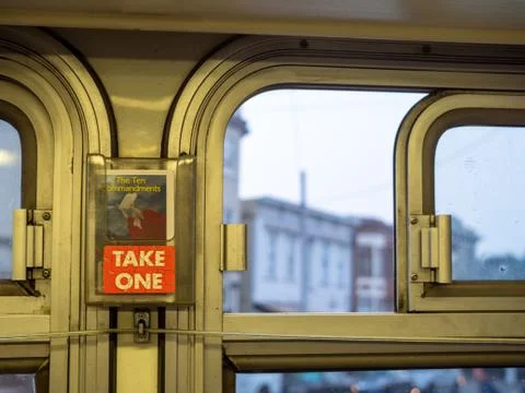 Bus with Ten Commandments religious pamphlet with take one sign handing near Stock Photos