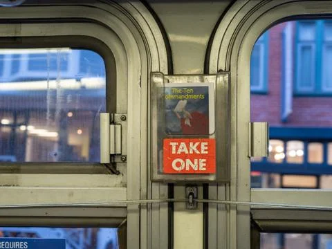 Bus with Ten Commandments religious pamphlet with take one sign handing near Stock Photos
