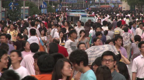 Bus weaves through crowd of bustling pedestrians Stock Footage 38171566