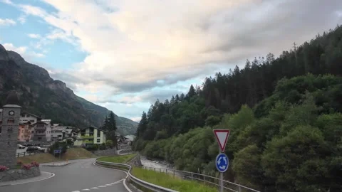 Bus Window View of Mountain Town and Winding Road Stock Footage 340366193