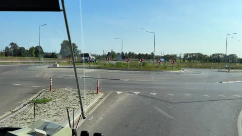 Bus windshield view driving on roundabout in Lithuania Vídeos de archivo 278314236