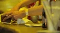 Busboy cleaning bar counter for visitors at nightclub, bartender at work HD Footage