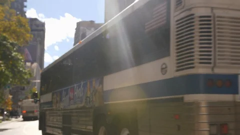 Buses And Traffic Drive Past New York Buildings And Skyscrapers  Stock Footage 113876934