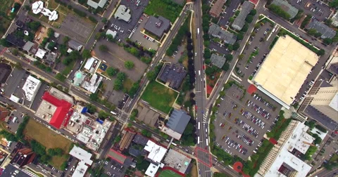 Buses on a broad avenue between parking lots and halls Stock Footage 63065007