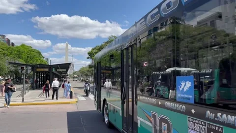 Buses drive along 9th of July Avenue in Buenos Aires Stock Footage 225273553