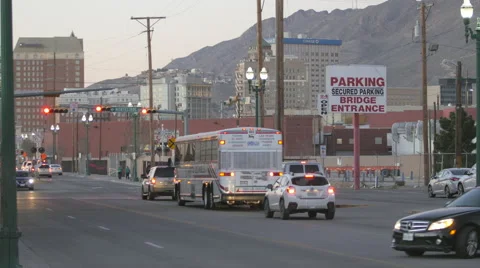 Buses Drive Through Border Town Intersection Stock Footage 60169817