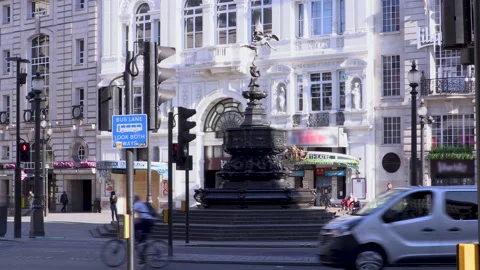 Buses go past and empty Eros Statue at Piccadilly Circus during lockdown Stock Footage 142735802
