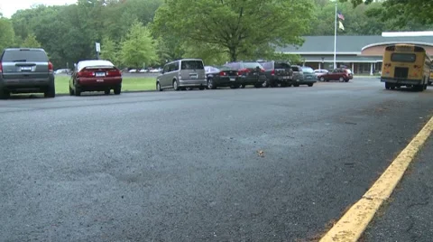 Buses leave the school (3 of 3) Stock Footage 8696595
