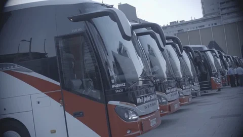 Buses lined up in slow motion, vignette Stock Footage 98764492
