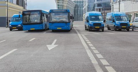 Buses move along a multi-lane avenue Stock Photos
