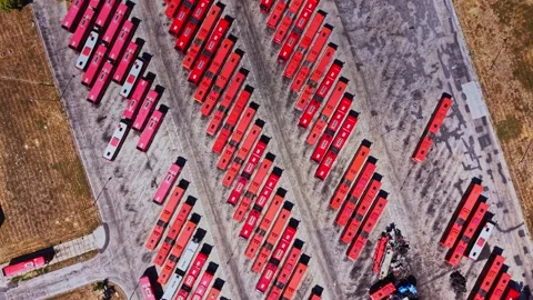 Buses parked in a large yard during daytime in a city Vidéo 343116478