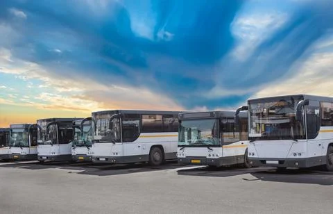 Buses on Parking on the background of cloudy sky Stock Photos