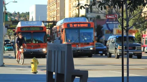 BUSES PASS EMPTY BENCH Stock-Footage 926065