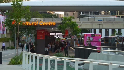 Buses passing through Platform 2 at the Cultural Centre Busway Station during Stock Footage 318715602