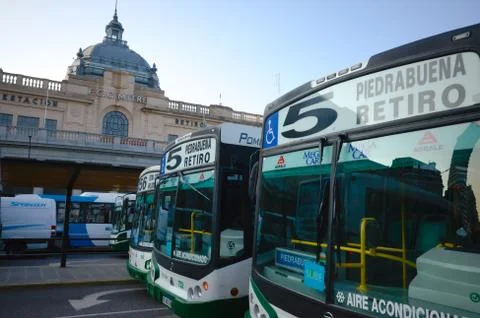 Buses of route 5 on a bus stop in front of Retiro railway station building Stock Photos