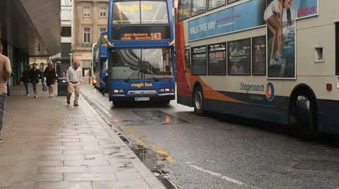 Buses stacking into a station Stock Footage 10688810