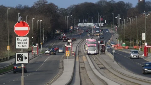 Buses using guided bus lane in the city of leeds uk Stock Footage 88616332