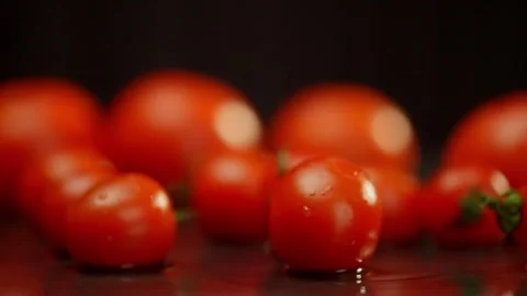 Bush tomatoes, a type of cherry tomato, sit on a table Stock Footage 267839804
