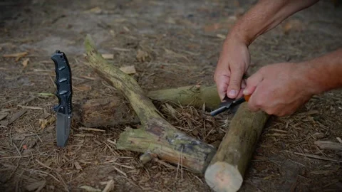 Bushcraft Fire Starting with Knife and Ferro Rod in Forest Stock Footage 342120457