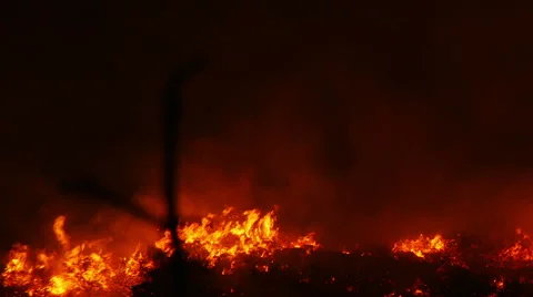 A bushfire burning orange and red at night Stock Footage 43011482