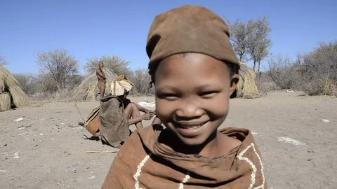 Bushmen child talking to camera Stock Footage 95634644