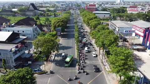 The busiest traffic light intersection in Banjarmasin, the intersection ent.. Stock Footage 314787009