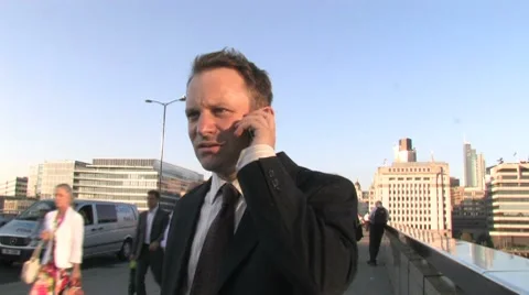 Busines man on cell phone Stock Footage 8769703