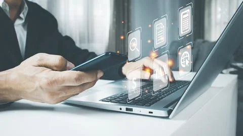 Busines using a computer to complete Individual income tax return form online Stock Photos