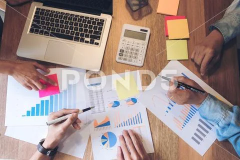 Business adviser analyzing financial with new startup finance project plan, c Stock Photos