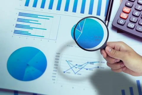 Business Analysis and Statistics Reports from sales charts last year using a  Stock Photos