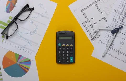 Business analysis in engineering. Graphs and charts, construction plans, calc Stock Photos